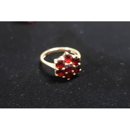 14 - Hallmarked gold and garnet flower design ring Size P (marks unknown and another Garnet marquise desi... 
