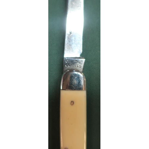 107 - Twin bladed pen knife by George Wostenholm of Sheffield (1.XL) with ivory handles