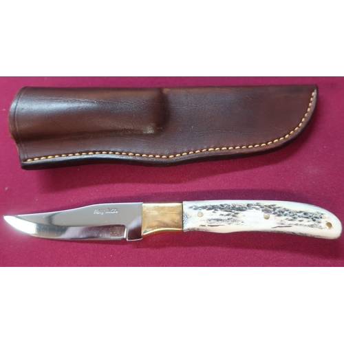 111 - Harry Boden sheath knife with full tang and clip blade, two piece antler handle with brass front bol... 