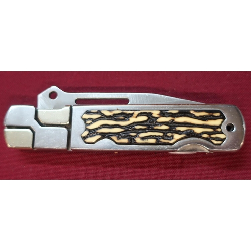 117 - American stainless steel handle and blade pocket knife with ornate design and plastic handle grip