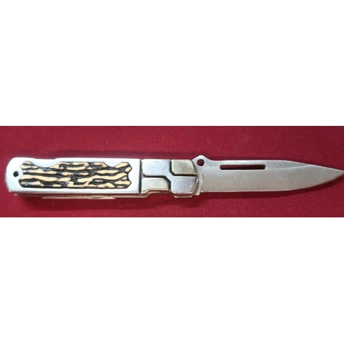 117 - American stainless steel handle and blade pocket knife with ornate design and plastic handle grip