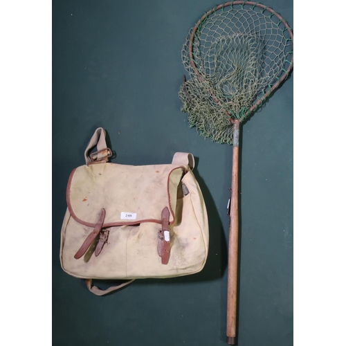 Canvas and leather fishing bag by Brody with a wooden handles fly fishing  landing net and reels