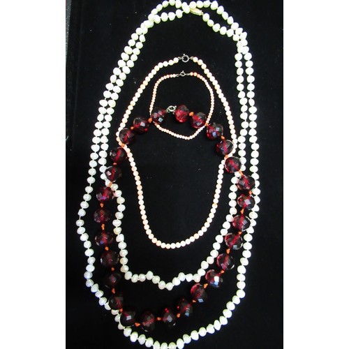 53 - Natural pearl necklace with 14ct gold clasp stamped 14K L145cm, a necklace with faceted ruby beads, ... 