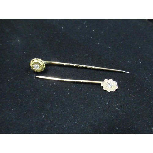 64 - Victorian 9ct gold pin and another similar with diamond to center a silver repoussé trinket dish and... 