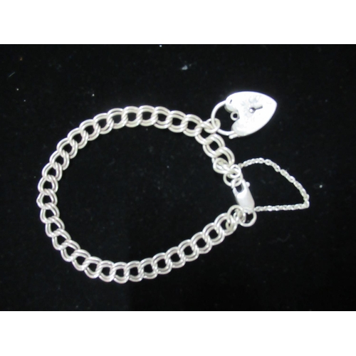 48 - Hallmarked Sterling silver double chain charm bracelet with souvenir charms heart padlock and anothe... 