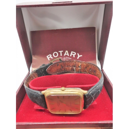 98 - Rotary quartz wristwatch, rectangular gold plated case on brown leather strap, snap on stainless ste... 