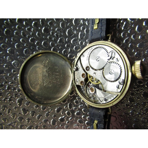 94 - Early C20th Waltham trench watch, rolled gold case on leather strap, movement signed and numbered 20... 