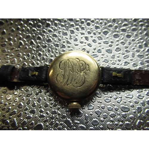 94 - Early C20th Waltham trench watch, rolled gold case on leather strap, movement signed and numbered 20... 