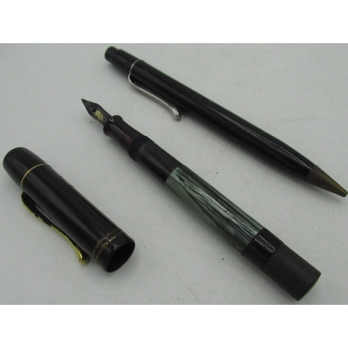 235 - 1930 - 1940 Pelikan 100 series fountain pen, black and green marbelised body and 14k gold nib, top i... 