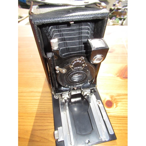 320 - Early C20th quarter plate camera with Vario shutter and additional plates in original canvas case, a... 