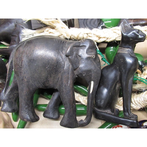 342 - Pair of ebony bookends in the form of elephants, two carved African hardwood busts, Masons jug and o... 