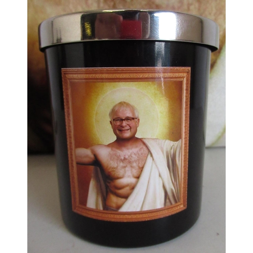 585 - Velour cushion printed with a study of Christopher Biggins, chest partially covered with loin cloth ... 