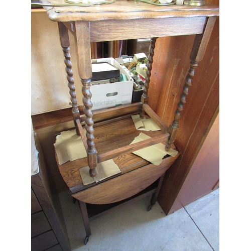 764 - 1930's oak two tier tea trolley with two D shaped fall leaves and a similar centre table with moulde... 