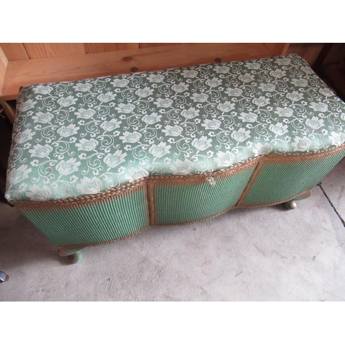 743 - Green and gilt Lloyd Loom type serpentine front blanket box, with hinged lid on cabriole legs with u... 