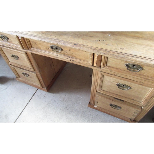 776 - Pine writing desk with rectangular top over nine drawers with turned wooden handles (122cm x 80cm x ... 