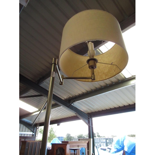 785 - Brushed metal standard lamp with articulated bracket on circular base and a lacquered brass and cera... 