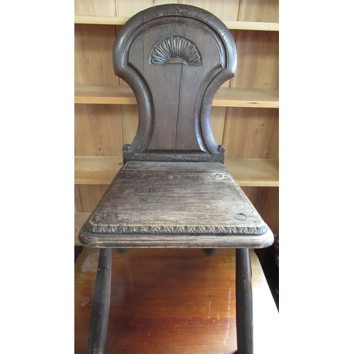 739 - Victorian oak hall chair with axehead back and shaped seat, on four turned outsplayed supports