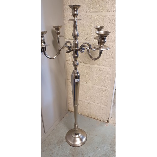 137 - C20th cast aluminium four branch floor standing candelabra H129cm