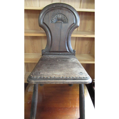 739 - Victorian oak hall chair with axehead back and shaped seat, on four turned outsplayed supports