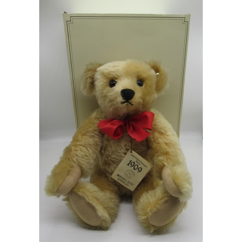 92 - Steiff 1909 Replica Teddy Bear in golden mohair with red ribbon, tag no. 406256, boxed, H40cm