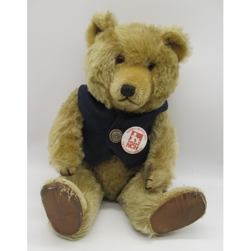 112 - Circa 1950's Chiltern working jingling teddy bear, in original condition, in golden mohair, with gla... 