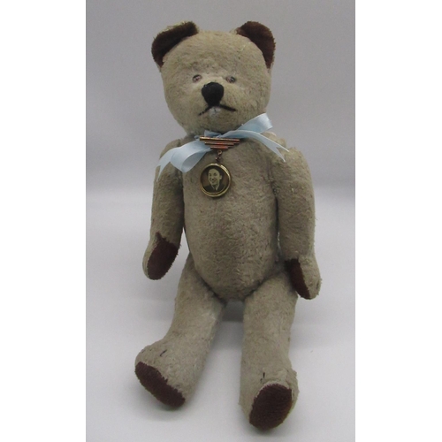128 - Circa 1930's possibly French teddy bear, in blonde mohair, with pale glass eyes, jointed arms and le... 