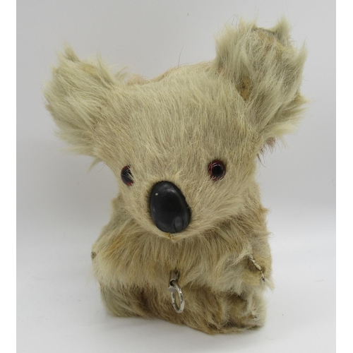 158 - Fully jointed rabbit fur koala bear with glass eyes, wearing a What A Day badge, sitting H22cm, and ... 