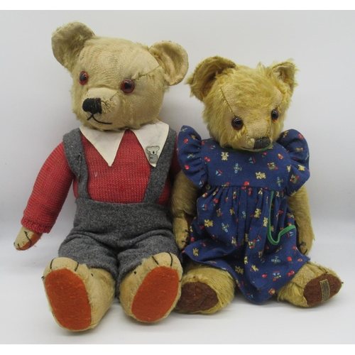 78 - Circa 1930s Merrythought teddy bear with glass eyes, jointed arms and legs and a swivel head wearing... 