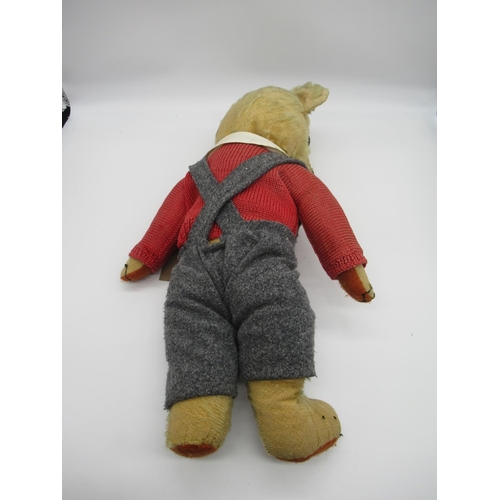 78 - Circa 1930s Merrythought teddy bear with glass eyes, jointed arms and legs and a swivel head wearing... 