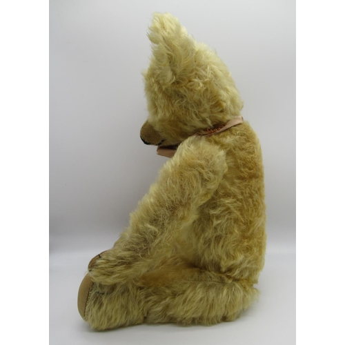 79 - Circa 1930s Merrythought teddy bear in golden mohair with tag on foot, button in ear, glass eyes, jo... 