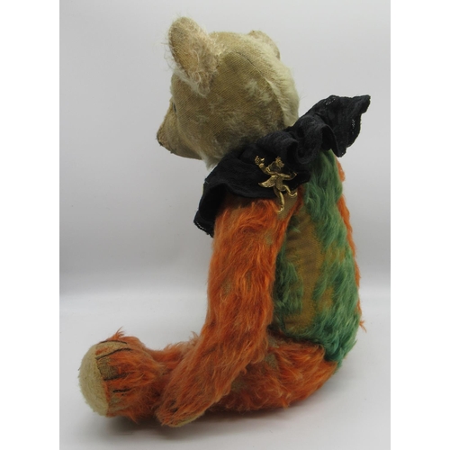58 - Unusual c. 1930s Jester teddy bear in green and red mohair with clear glass eyes, jointed arms and l... 