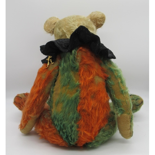 58 - Unusual c. 1930s Jester teddy bear in green and red mohair with clear glass eyes, jointed arms and l... 