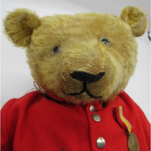 135 - Early C20th large American teddy bear in blonde mohair with clear glass eyes, non-working growler me... 