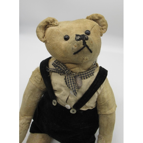 131 - C. 1920's French teddy bear with boot button eyes, a silent growler, swivel head and jointed arms an... 