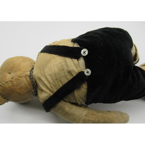 131 - C. 1920's French teddy bear with boot button eyes, a silent growler, swivel head and jointed arms an... 