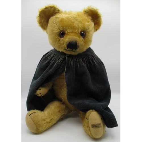 73 - Merrythought c. 1930's teddy bear in golden mohair with glass eyes, label on foot, jointed arms and ... 