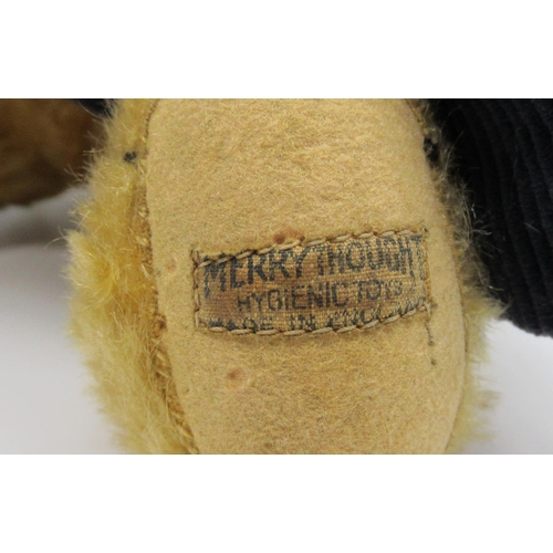 73 - Merrythought c. 1930's teddy bear in golden mohair with glass eyes, label on foot, jointed arms and ... 