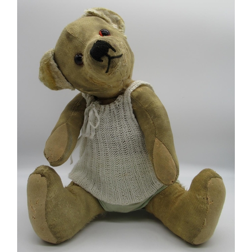 38 - Merrythought c. 1930's teddy bear with glass eyes, jointed arms and legs and swivel head, wearing kn... 