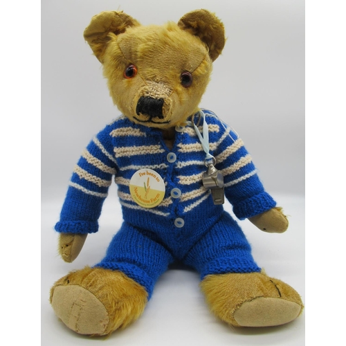 74 - Merrythought c. 1940/50's teddy bear with glass eyes and repaired foot pads, wearing blue romper, H4... 