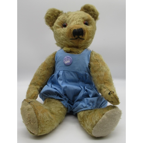 74 - Merrythought c. 1940/50's teddy bear with glass eyes and repaired foot pads, wearing blue romper, H4... 