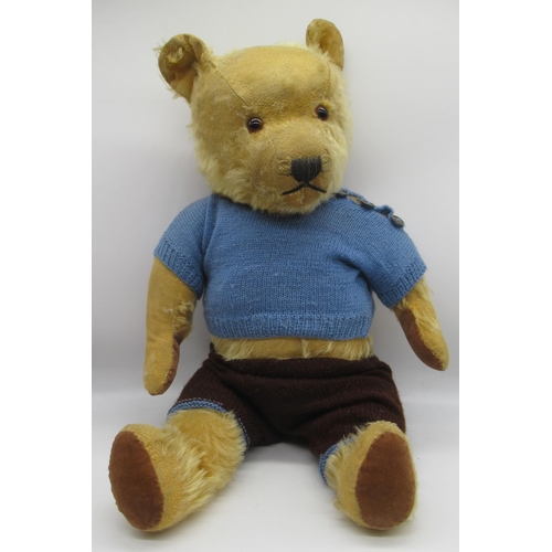 109 - Chiltern c. 1940/50's teddy bear in golden mohair, with glass eyes, jointed arms and legs, swivel he... 