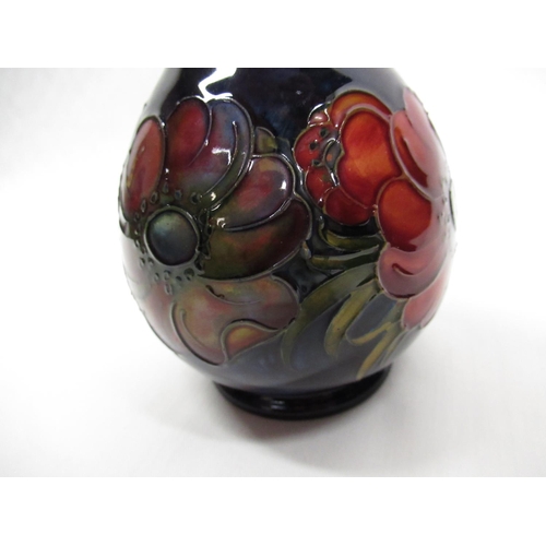 302 - Moorcroft mallet shaped vase decorated in Anemone pattern on a blue ground, impressed marks and gree... 