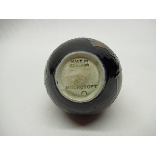 304 - Small Moorcroft squat vase decorated in Pomegranate pattern on a blue ground, impressed marks, H7cm