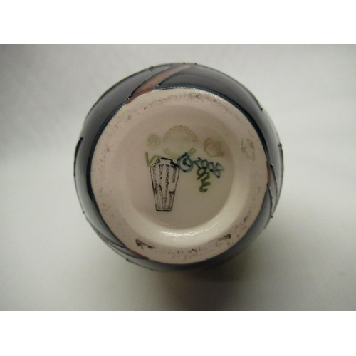 323 - Moorcroft baluster vase decorated with Dandelions on a blue ground, painted marks to base, H13cm, in... 