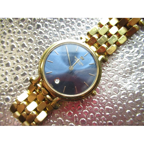 51 - 1994 Raymond Weil quartz wristwatch with date. 18 K gold plated case on matching bracelet with deplo... 