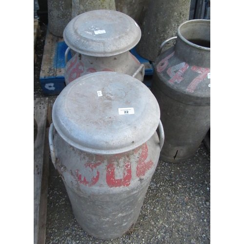 22 - Two milk churns with lids