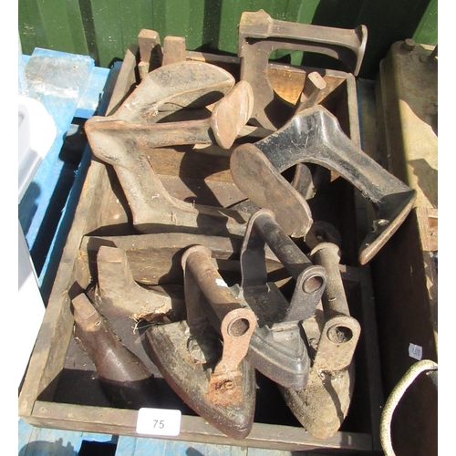 75 - Box containing cobblers lasts of various sizes and 3 irons