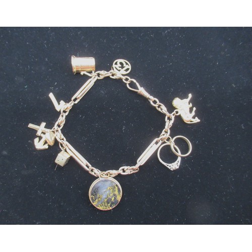 9 - Hallmarked 9ct gold charm bracelet with marked and unmarked charms some stamped 9.375, 26.2g gross