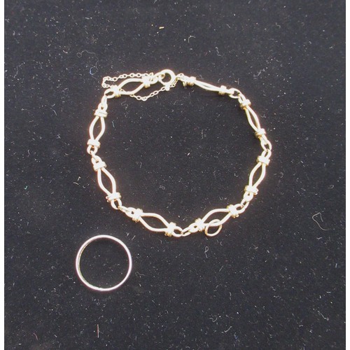 10 - 9ct gold chain bracelet with safety chain stamped 9K and a hallmarked 9ct gold wedding band Size M 1... 