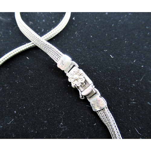 11 - Silver woven chain necklace with lion pendant inset with blue hardstone and box clasp stamped 925 an... 